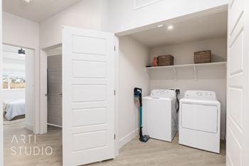 Laundry room with shelves